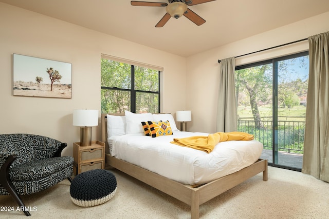 bedroom featuring ceiling fan, access to exterior, and carpet flooring