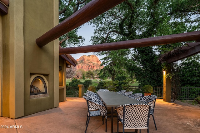 view of patio / terrace featuring a large fireplace