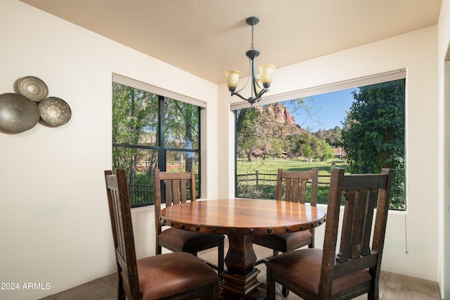 dining space with a notable chandelier