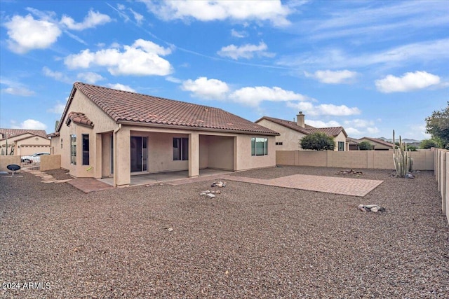 rear view of house with a patio