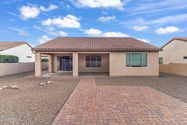 rear view of house featuring a patio area