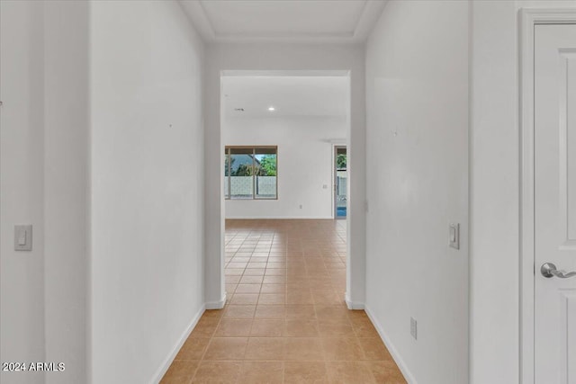 hall with light tile patterned floors