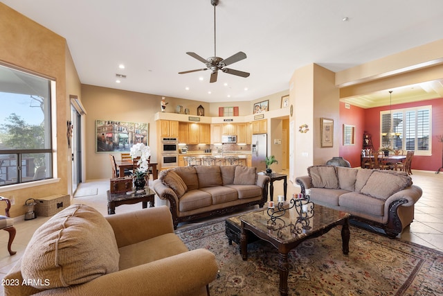 living area featuring light tile patterned flooring, visible vents, recessed lighting, and ceiling fan