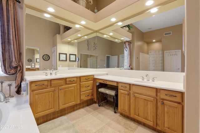 full bathroom featuring tile patterned flooring, visible vents, recessed lighting, and vanity