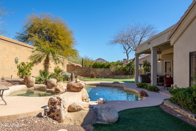 view of swimming pool with a patio area, a fenced backyard, and a fenced in pool