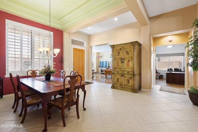 dining room with light tile patterned floors, recessed lighting, baseboards, and an inviting chandelier