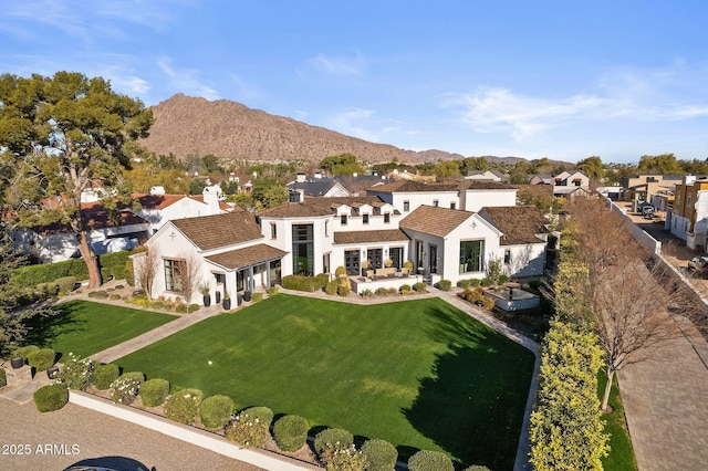 birds eye view of property featuring a mountain view