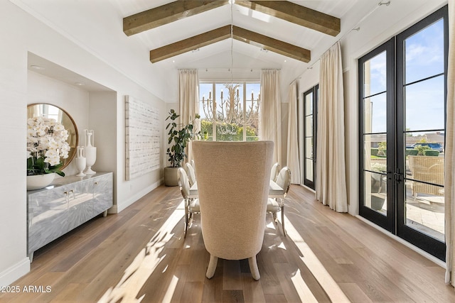 sunroom with vaulted ceiling with beams and french doors