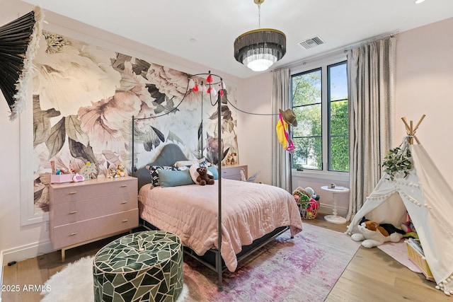 bedroom featuring wood-type flooring