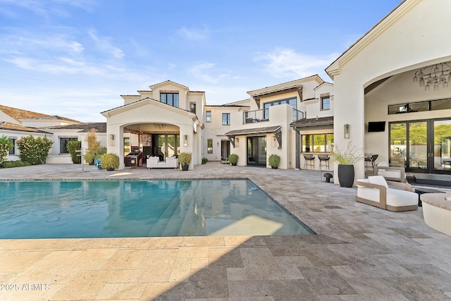 rear view of property featuring a patio area