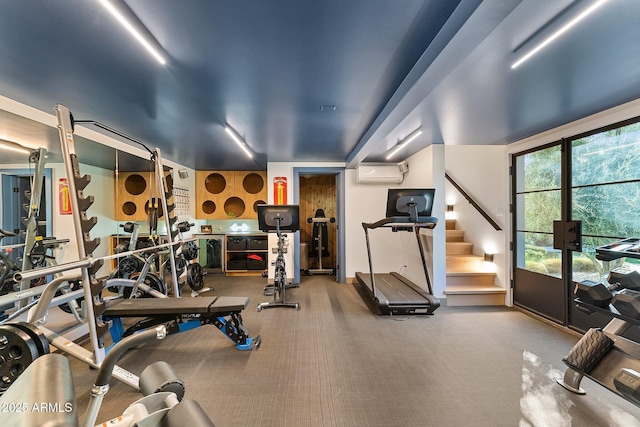 exercise room with a wall mounted AC