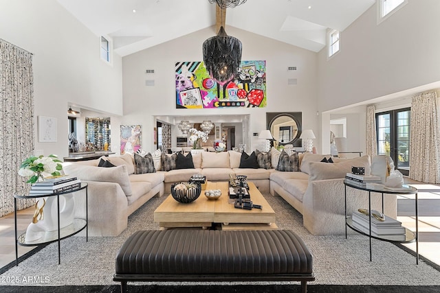 living room featuring french doors and beamed ceiling