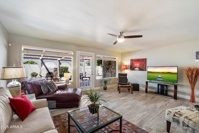7736 E Hazelwood St, Scottsdale, AZ 85251 - living area featuring a ceiling fan, baseboards, and wood finished floors