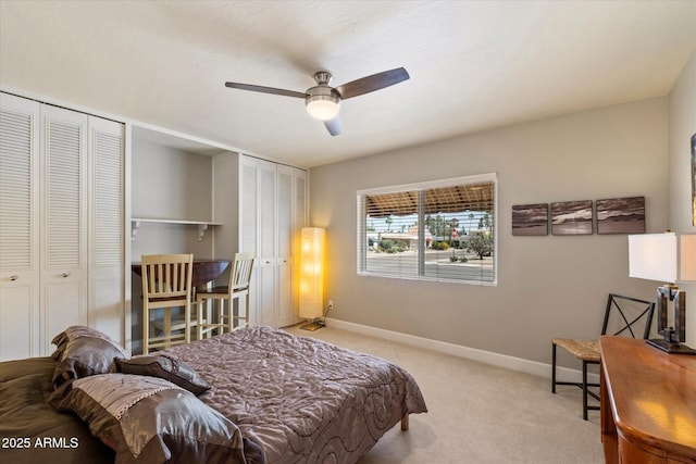 7736 E Hazelwood St, Scottsdale, AZ 85251 - bedroom with carpet floors, baseboards, multiple closets, and ceiling fan