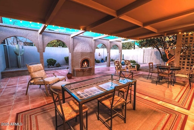 7736 E Hazelwood St, Scottsdale, AZ 85251 - view of patio / terrace with a fireplace, outdoor dining area, and a fenced backyard