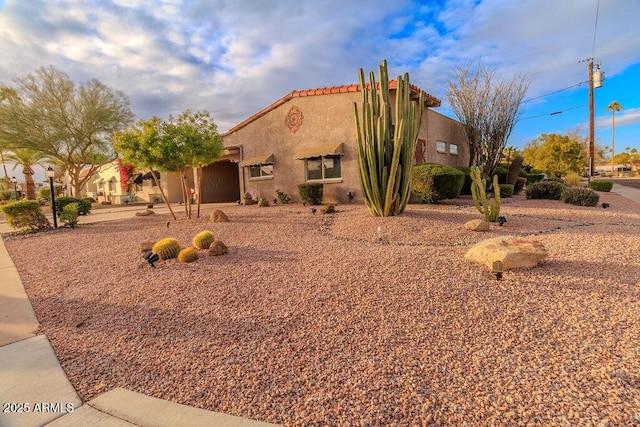 7736 E Hazelwood St, Scottsdale, AZ 85251 - exterior space featuring a tiled roof and stucco siding