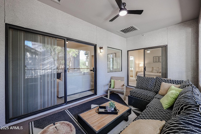 living room featuring ceiling fan