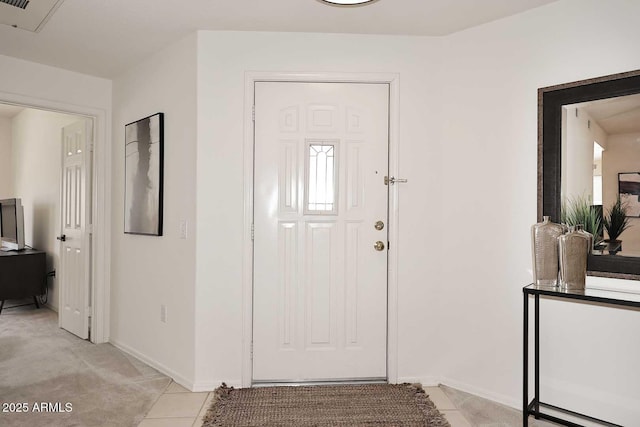 entryway with light tile patterned floors