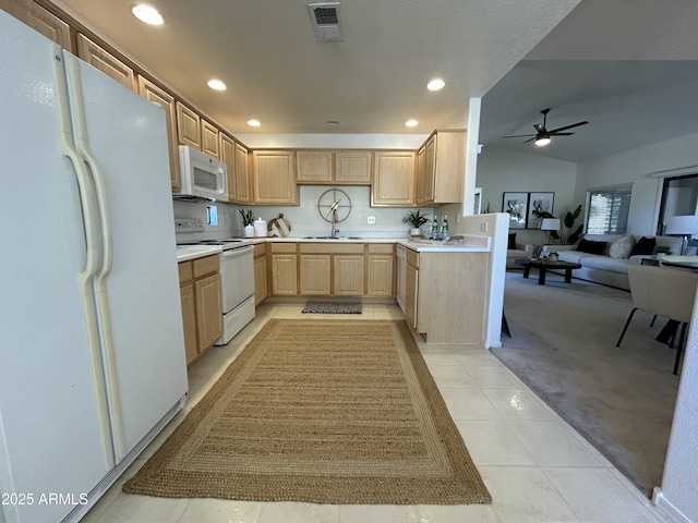 kitchen with ceiling fan, light brown cabinets, white appliances, light tile patterned flooring, and vaulted ceiling