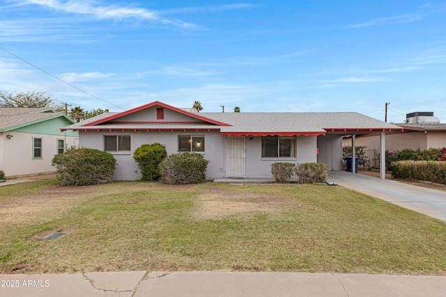 ranch-style home featuring driveway, an attached carport, and a front yard