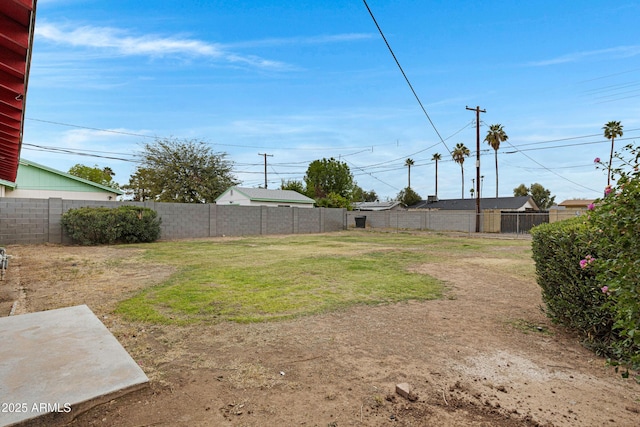 view of yard with a fenced backyard