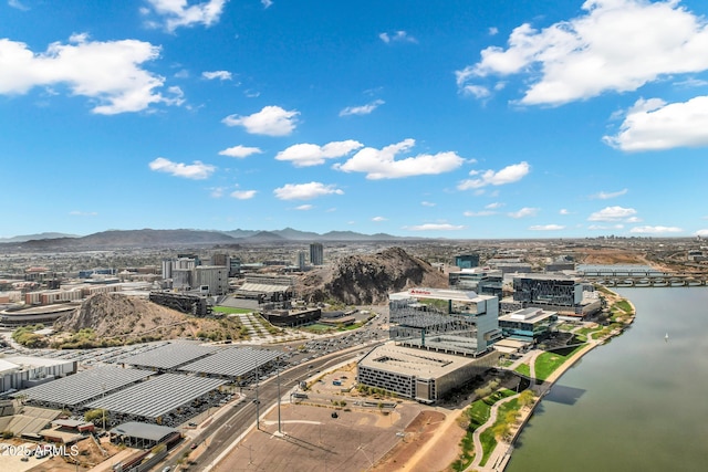 birds eye view of property with a view of city and a water and mountain view