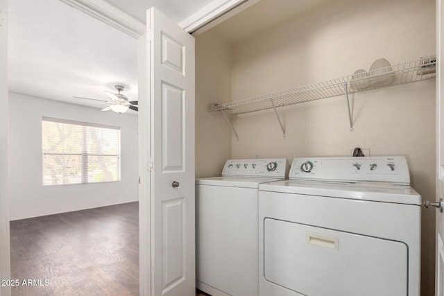 laundry room with separate washer and dryer, wood finished floors, and ceiling fan