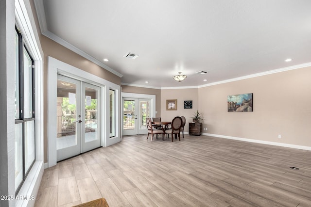 sitting room with french doors, recessed lighting, crown molding, baseboards, and light wood-style floors