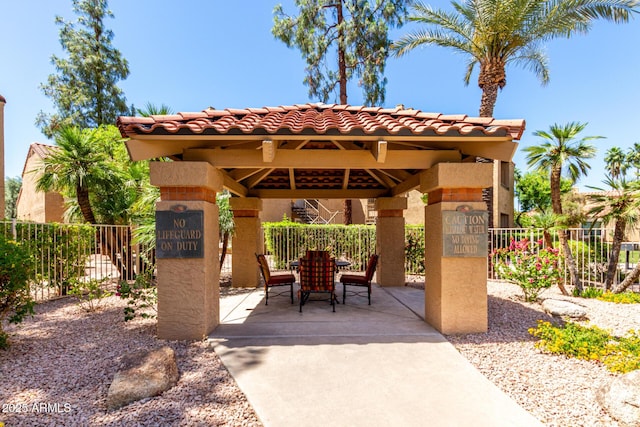 view of patio with fence and a gazebo