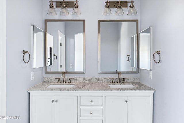 full bath featuring double vanity and a sink