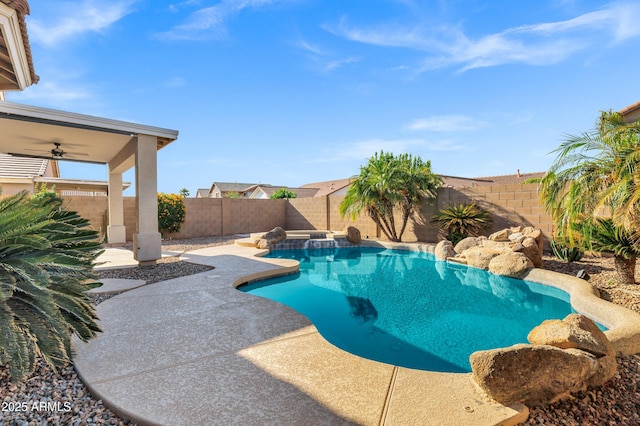view of swimming pool featuring a fenced backyard, a patio area, and a pool with connected hot tub