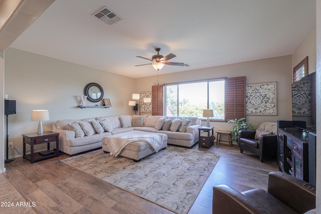 living room with ceiling fan and hardwood / wood-style floors