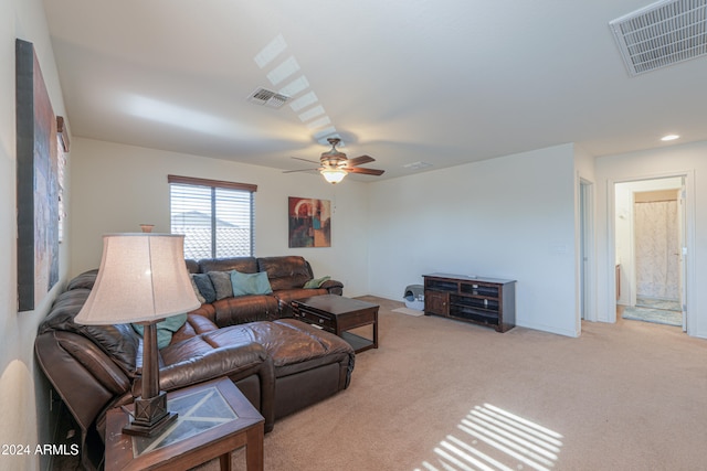 carpeted living room featuring ceiling fan