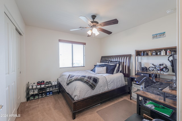 bedroom with carpet flooring, a closet, and ceiling fan