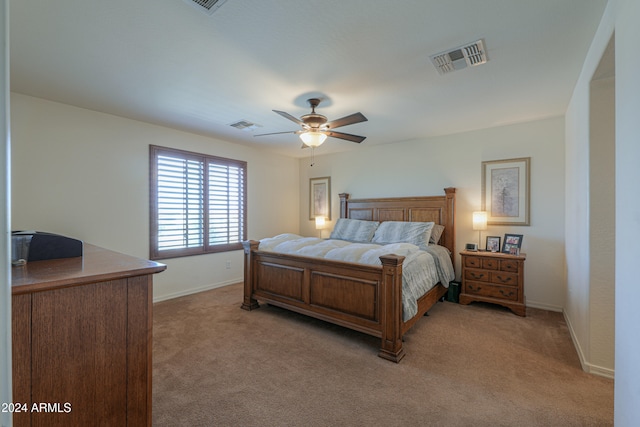 bedroom with ceiling fan and light colored carpet