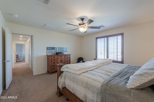 bedroom featuring light colored carpet and ceiling fan