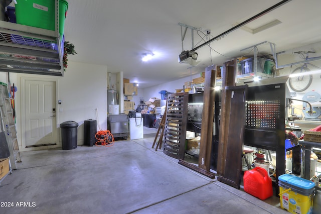 garage featuring a garage door opener and water heater