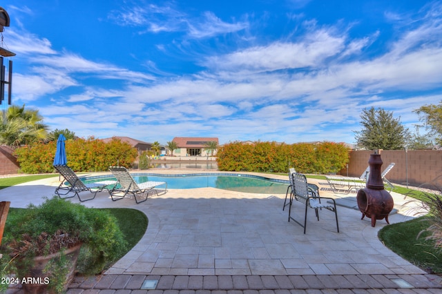 view of swimming pool with a patio area