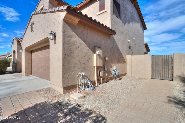 view of side of home with a garage