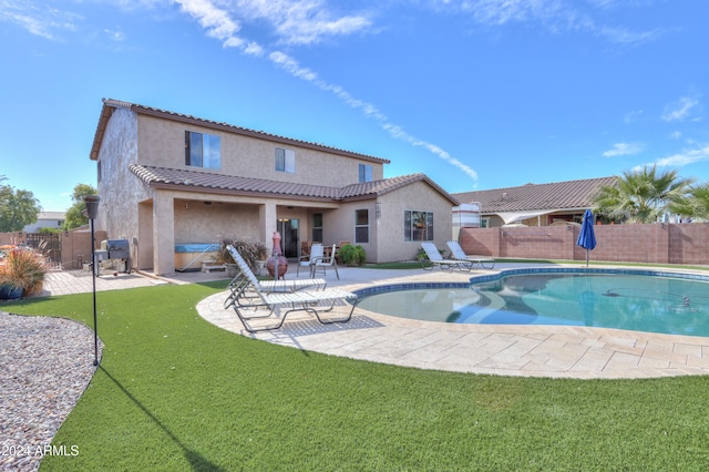 view of pool with a yard and a patio area