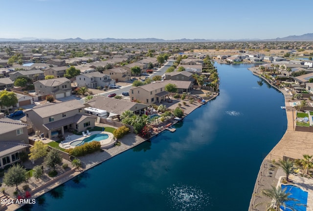 bird's eye view with a water and mountain view