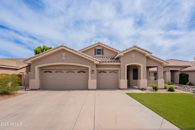 1635 E Harrison St, Chandler, AZ 85225 - mediterranean / spanish-style house featuring stucco siding, an attached garage, concrete driveway, a tile roof, and a front lawn