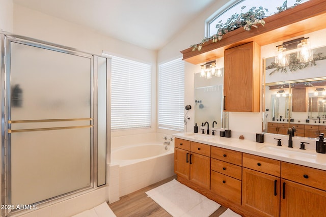 1635 E Harrison St, Chandler, AZ 85225 - full bathroom with double vanity, a bath, lofted ceiling, a shower stall, and wood finished floors