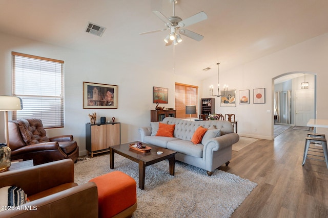 1635 E Harrison St, Chandler, AZ 85225 - living area with ceiling fan, arched walkways, light wood finished floors, lofted ceiling, and plenty of natural light
