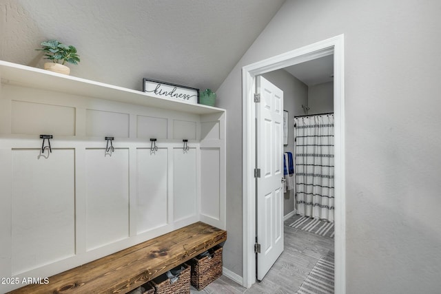 mudroom with vaulted ceiling