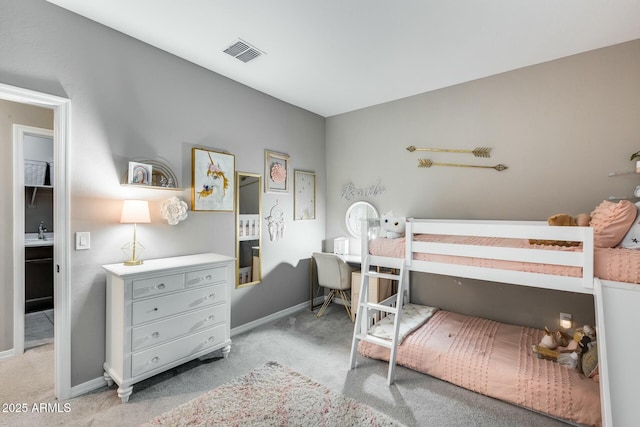 bedroom with light carpet and sink