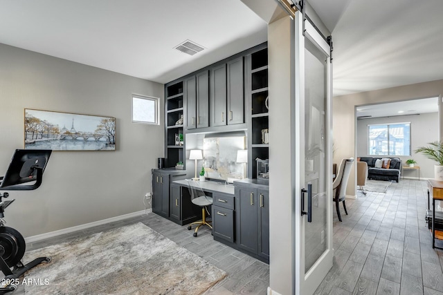 office area with a barn door