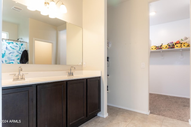 bathroom with vanity and tile patterned floors