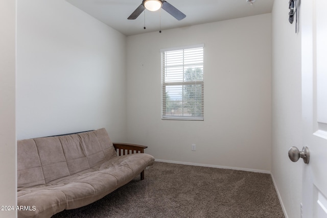 living area featuring ceiling fan and carpet floors