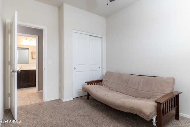 sitting room with light carpet and ceiling fan